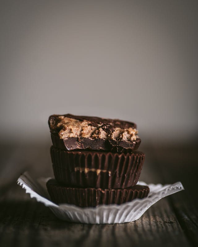Peanut Butter filled chocolate cups stacked on top of each other